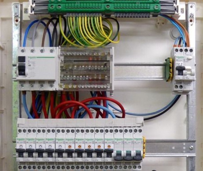 Electrical panel with neatly arranged circuit breakers and wiring, installed by SparkSonic for safe and efficient power distribution.