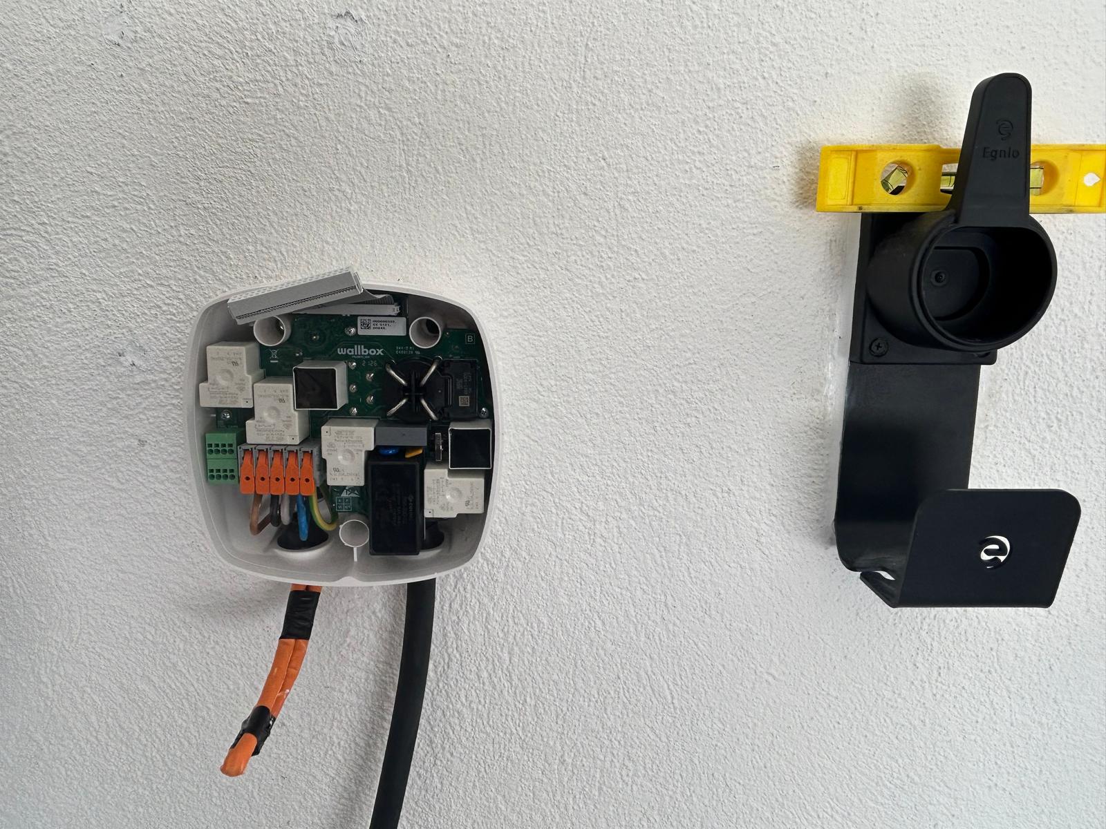 Open Wallbox Pulsar Plus EV charger showing internal wiring and components during installation by SparkSonic.